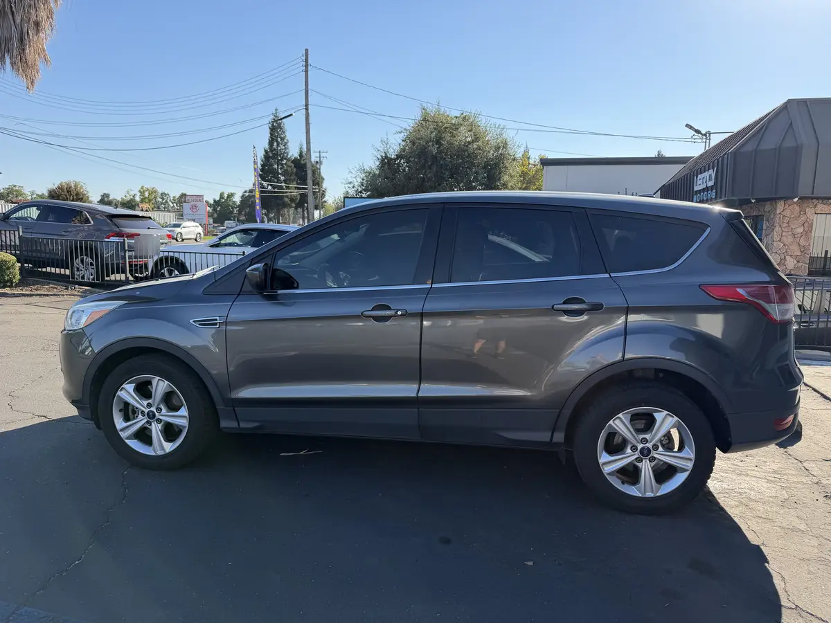 Gray Ford Escape at Quality Window Tinting, ceramic window tint job (photo 1)