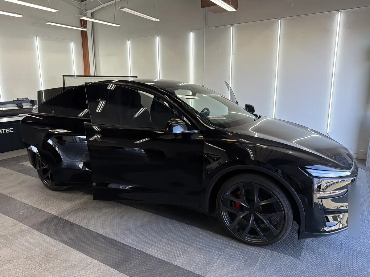 Black Tesla Model Y after Avery Dennison Encore Supreme ceramic window tint (view 1)