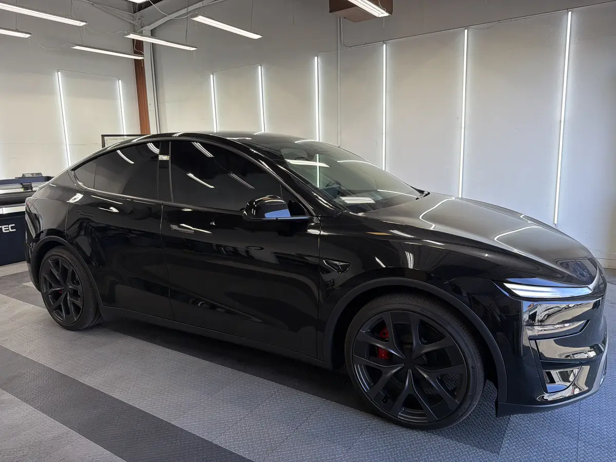 Black Tesla Model Y after Avery Dennison Encore Supreme ceramic window tint (view 2)