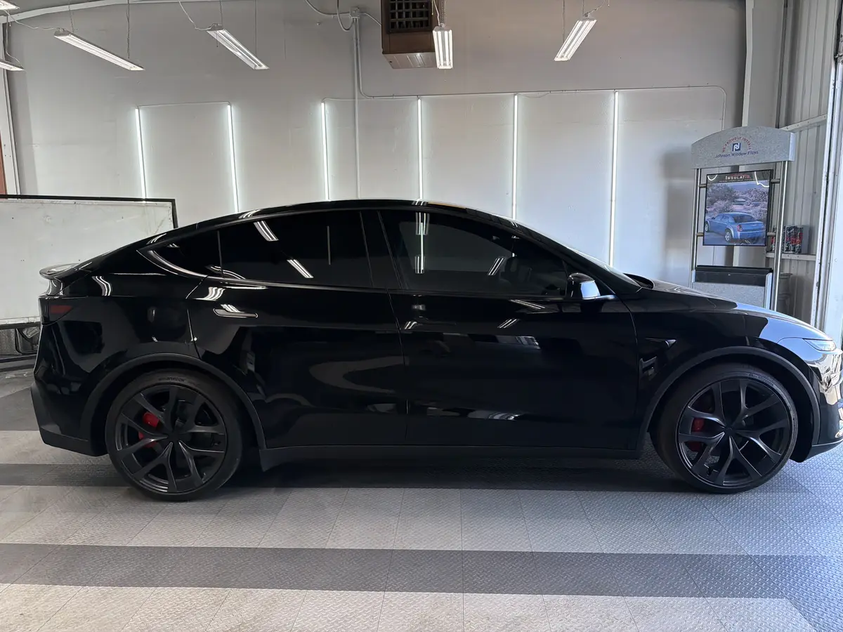 Black Tesla Model Y after Avery Dennison Encore Supreme ceramic window tint (view 3)