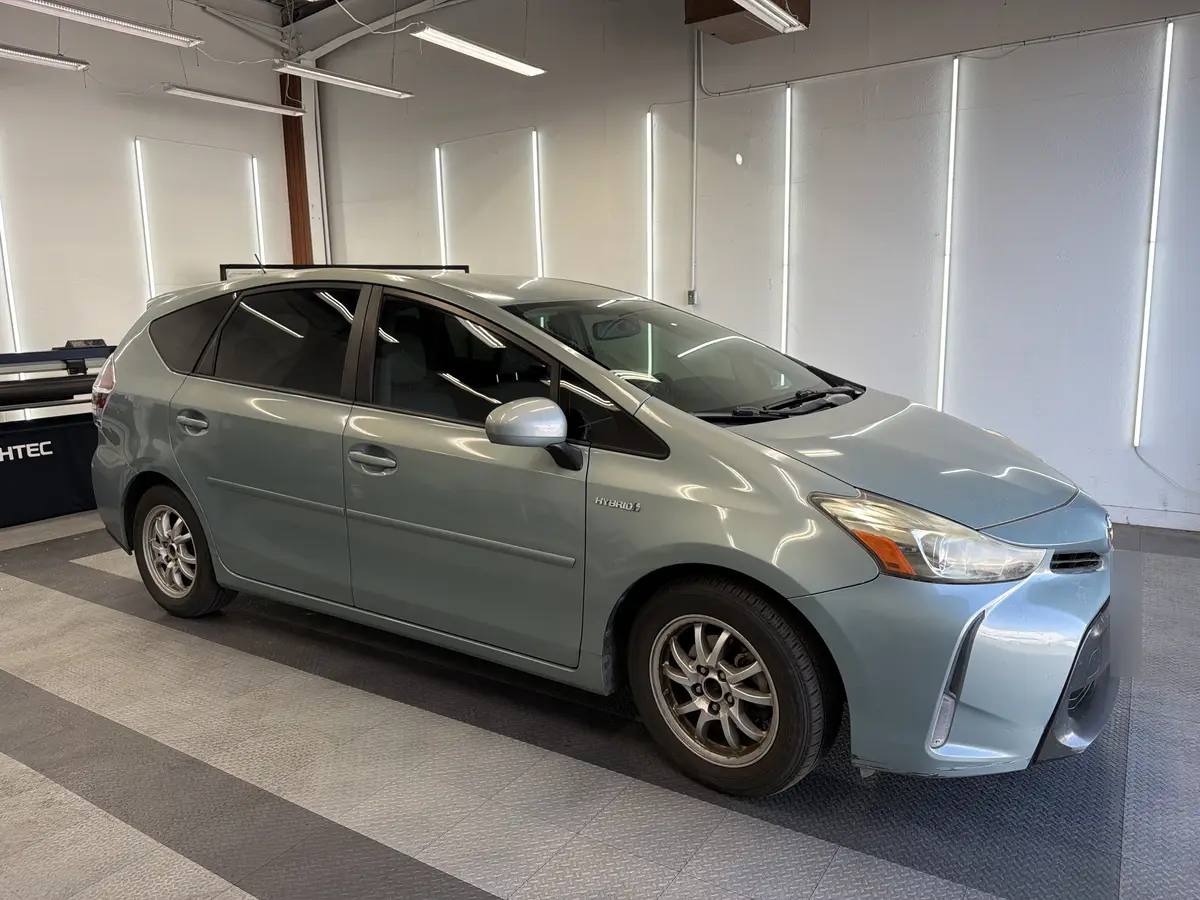 Blue Toyota Prius v after Avery Dennison Encore Supreme ceramic window tint (view 1)