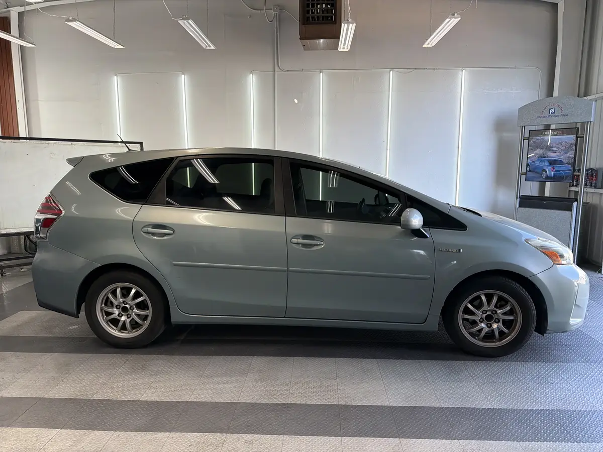 Blue Toyota Prius v after Avery Dennison Encore Supreme ceramic window tint (view 2)
